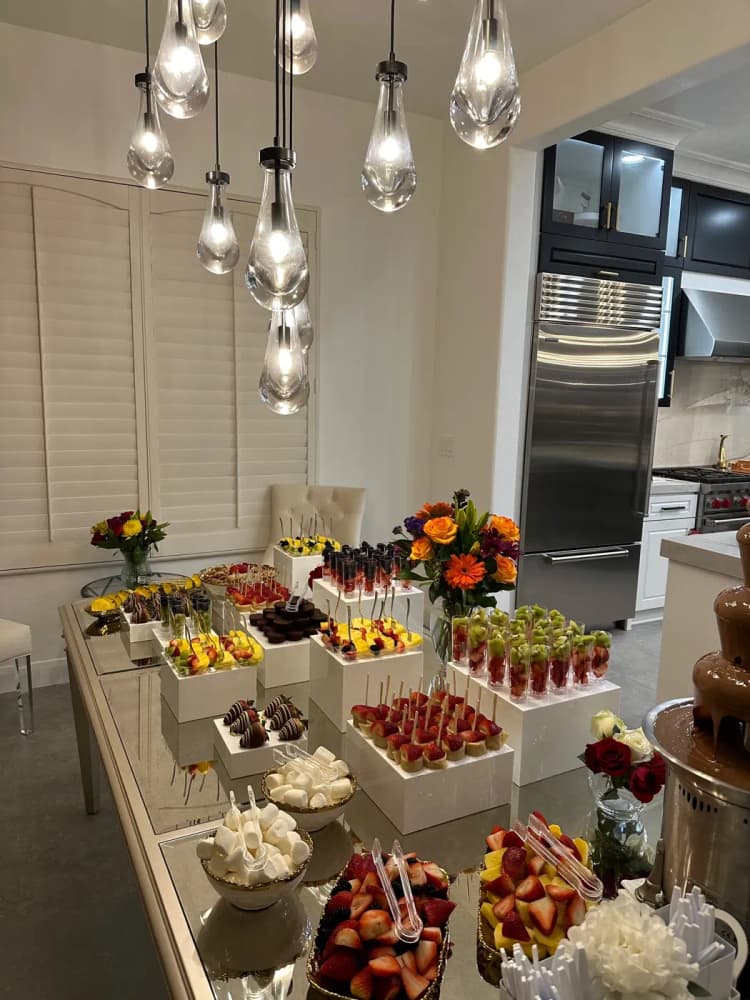 Chocolate fountain with dipping items at a catered event